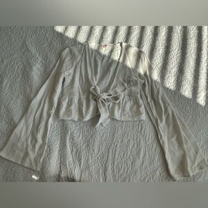 White bell-sleeved front tie crop top